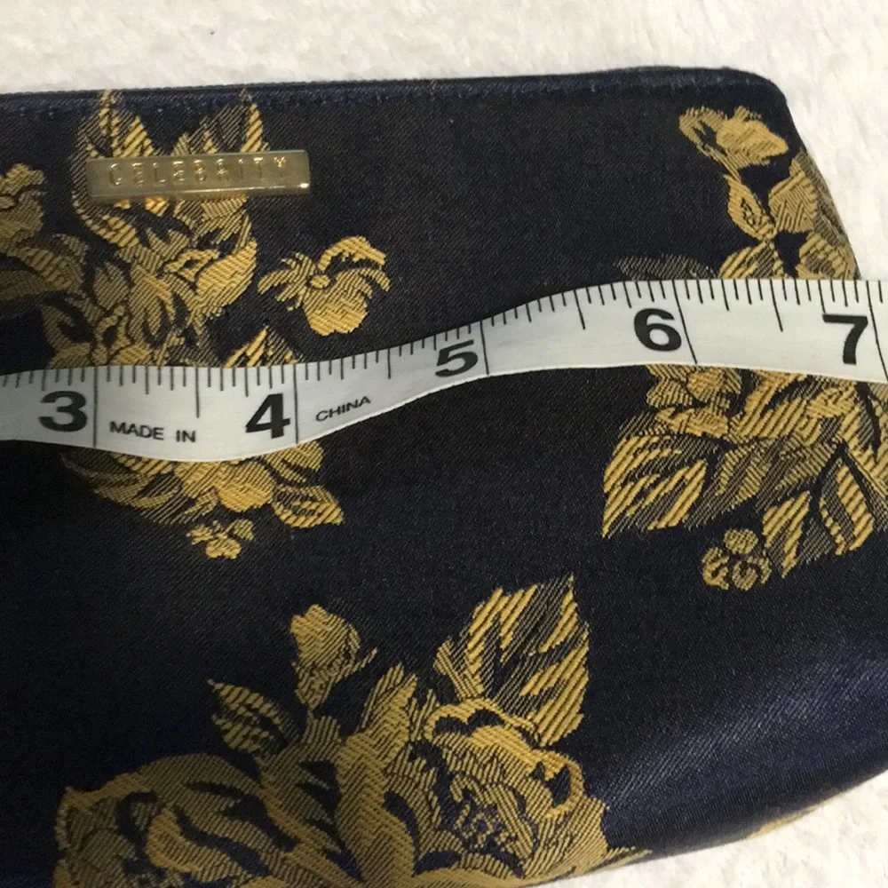 Celebrity travel bag and matching makeup bag. Navy blue with gold flowers